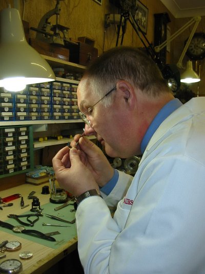 Michael Swift working at his workshop desk